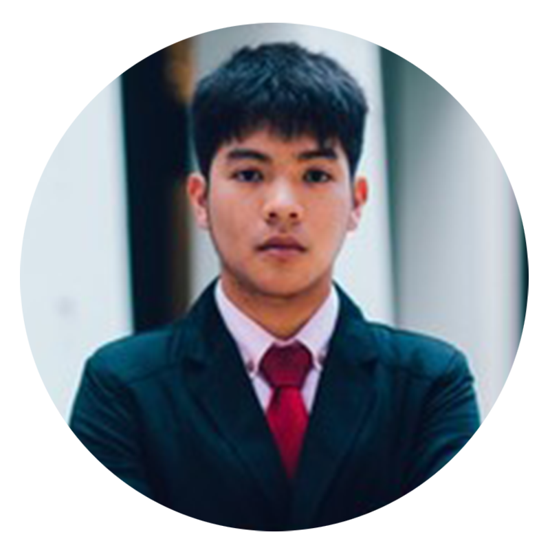 Young man in suit with red tie.